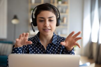 woman wearing headset at computer